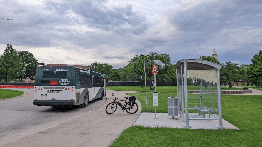 A SMART bus on Route 790 stationed at Oakland University, showcasing key public transit options in Rochester.