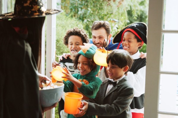 Well-lit porch and visible decorations make homes welcoming and safer for trick-or-treaters.